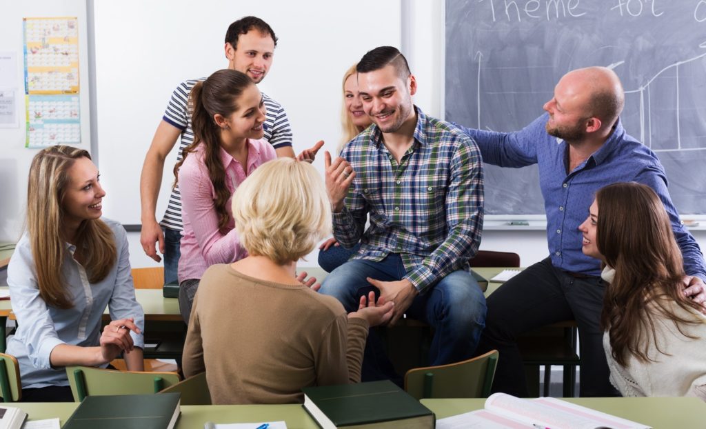 Professor consulting a different age students at the extension courses Learner-Centered Curriculum - It is all about you